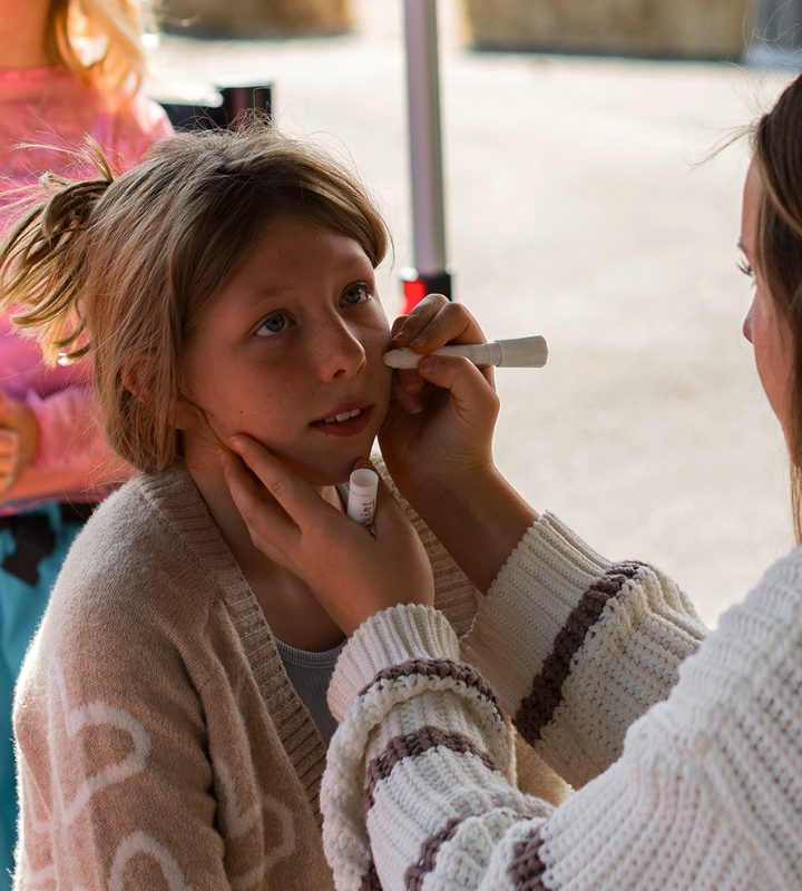 A girl getting her face painted